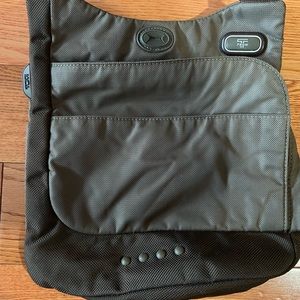 Tumi crossbody travel bag.